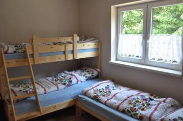 Фото номера Дом с 4 спальнями Дома для отпуска Domki w Radawie г. Радава 10